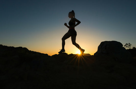 Woman  running or completing a fitness challenge